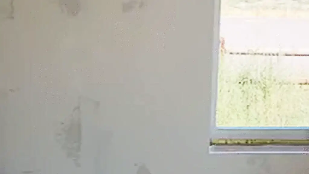 Interior home renovation showing newly installed drywall and textured walls.