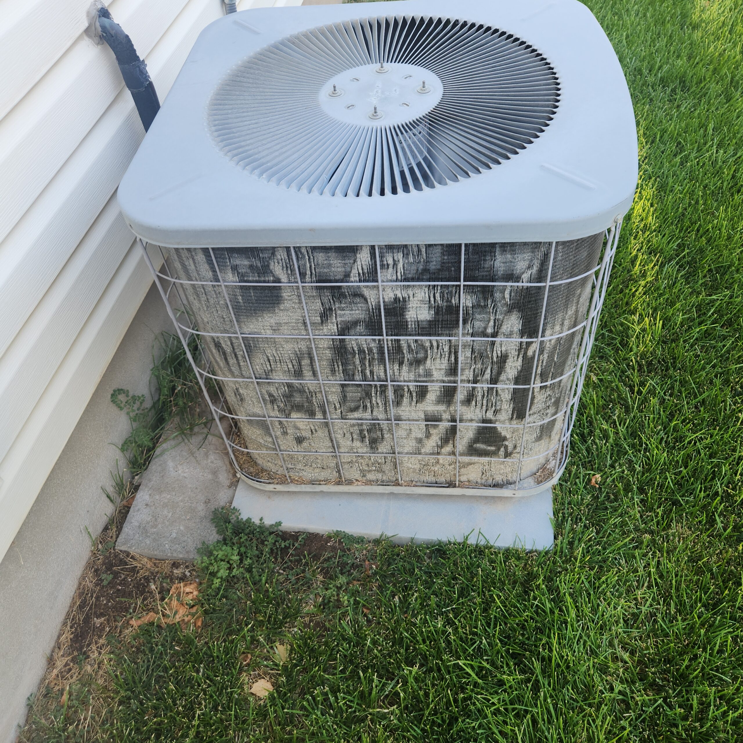Technicians replacing outdoor HVAC unit