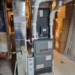 High-efficiency modulating furnace installed in a small utility room